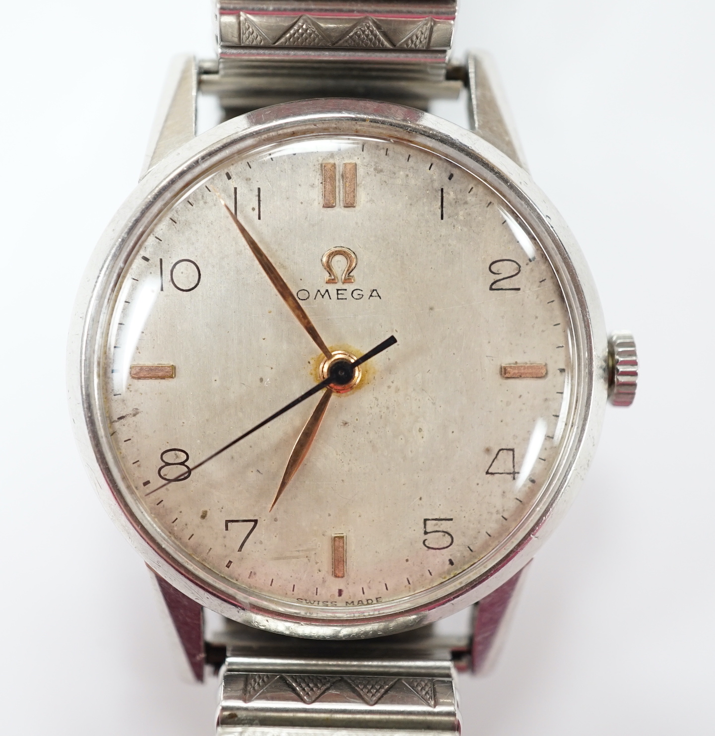 A gentleman's late 1940's stainless steel Omega manual wind wrist watch, movement c.283, on associated strap.